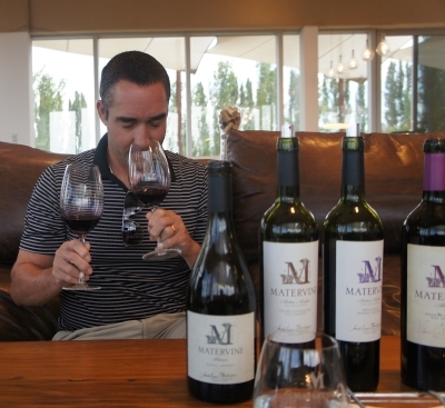 Gary with his hands full with a comparison of terroir tasting at Matervini winery