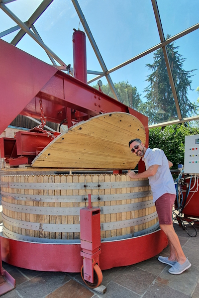 Having fun peeking inside the wine presses at the Bellavista winery